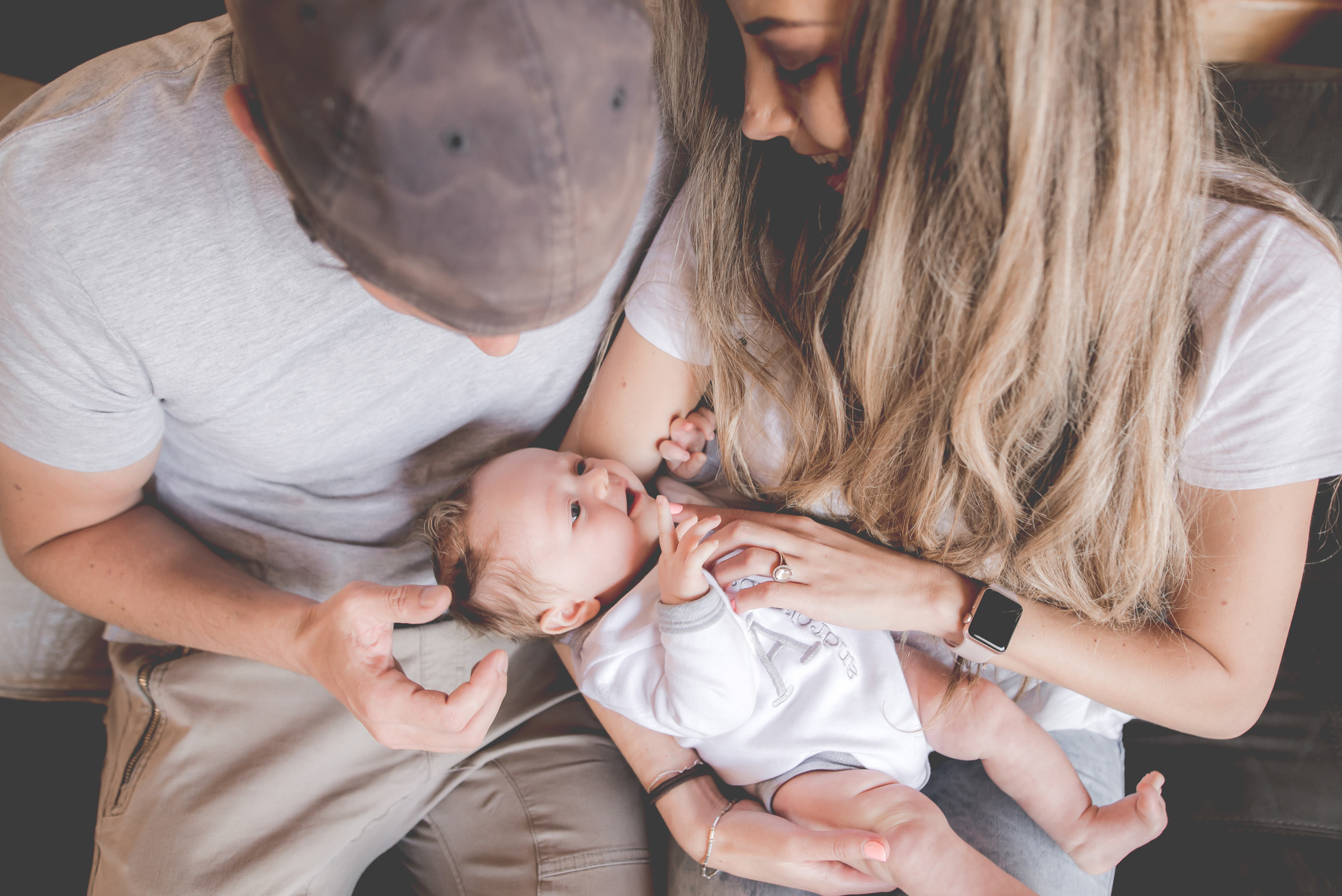 Parents Holding Newborn Child